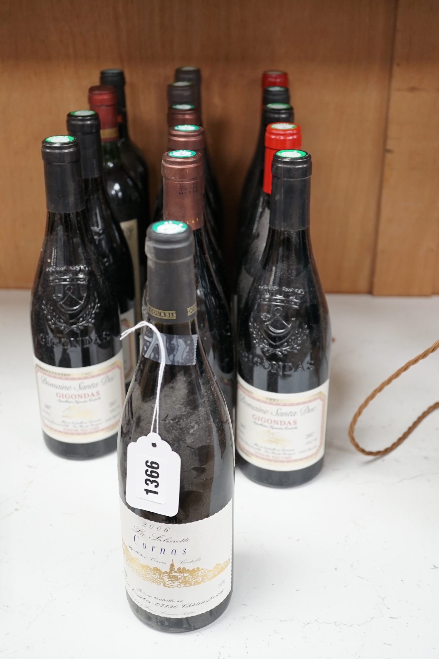 Eighteen bottles of wine to include La Sabarotte Coronas 2006, Domaine Santa Duc Gigondas 2007, Longue Toque Vacqueyras 2008, Marquise de la Tourette 2006, Chateau Haut-Bages 1990, etc. Condition - good, storage history